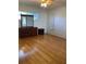 Bedroom with hardwood floors, dresser, and a ceiling fan at 1811 Ridge S Rd, Largo, FL 33778
