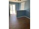 Versatile bonus room with stylish wood-look tile flooring and natural light, perfect for a home office or extra living space at 1811 Ridge S Rd, Largo, FL 33778