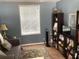 Serene room features a love seat, bright window and a bookshelf at 1811 Ridge S Rd, Largo, FL 33778