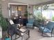 Relaxing screened-in porch with comfortable seating, providing an ideal outdoor living space at 1811 Ridge S Rd, Largo, FL 33778