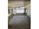 The covered and screened-in porch overlooks the backyard at 1811 Ridge S Rd, Largo, FL 33778
