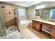 Bathroom featuring shower, tub, vanity with dual sinks, and a large mirror at 2111 Roanoke Springs Dr, Ruskin, FL 33570