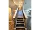 Staircase with wood floors leads upstairs at 2111 Roanoke Springs Dr, Ruskin, FL 33570