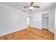 Bright bedroom with ceiling fan, closet, hardwood floors, and white walls for a clean look at 2169 22Nd N Ave, St Petersburg, FL 33713