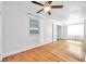 Sunlit bedroom showcasing hardwood floors, white walls, and a closet at 2169 22Nd N Ave, St Petersburg, FL 33713