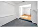 Bonus room with gray painted flooring and bright white walls that leads to another room at 2169 22Nd N Ave, St Petersburg, FL 33713