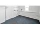 Bright laundry room with utility connections, window and convenient built-in shelving at 2169 22Nd N Ave, St Petersburg, FL 33713