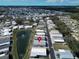 Beautiful aerial view of a well-maintained neighborhood with a pond and fountain, featuring lush landscaping at 222 N Saint George Cir, Apollo Beach, FL 33572