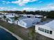 An aerial view of cozy manufactured homes near a canal offering tranquil waterfront living at 222 N Saint George Cir, Apollo Beach, FL 33572