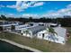 Aerial view of a mobile home community under blue skies with scattered palm trees at 222 N Saint George Cir, Apollo Beach, FL 33572