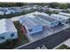 Beautiful aerial view of charming mobile homes in a lakeside community with mature trees and manicured lawns at 222 N Saint George Cir, Apollo Beach, FL 33572