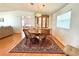 Cozy dining room with hardwood floors, elegant lighting, and seating for four at 222 N Saint George Cir, Apollo Beach, FL 33572