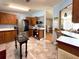 This traditional style kitchen features stainless steel appliances, wood cabinets and a tiled backsplash at 222 N Saint George Cir, Apollo Beach, FL 33572