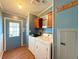 Bright laundry room featuring a washer, dryer, and plenty of cabinet space at 222 N Saint George Cir, Apollo Beach, FL 33572