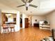 Bright open-concept living room with wood laminate flooring and plenty of natural light at 222 N Saint George Cir, Apollo Beach, FL 33572