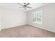 Bedroom showcasing natural light with a ceiling fan and shutters on the windows at 2494 Caretta Ave, Spring Hill, FL 34609