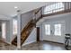 Inviting foyer featuring a staircase, beautiful tile floors, and a decorative front door with sidelights at 2965 Eagle Estates E Cir, Clearwater, FL 33761