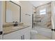 Clean bathroom with a tub and shower combo, updated vanity and a neutral color palette at 4006 N 27Th St, Tampa, FL 33610
