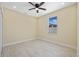 Cozy room features natural light from the window, a ceiling fan, and tile flooring at 4006 N 27Th St, Tampa, FL 33610