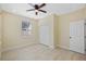 Bedroom featuring tile floors, ample natural light, a ceiling fan and a closet at 4006 N 27Th St, Tampa, FL 33610