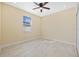 This is a bright bedroom with a ceiling fan and an abundance of natural light at 4006 N 27Th St, Tampa, FL 33610