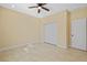 This bedroom features a ceiling fan, closet and neutral color palette at 4006 N 27Th St, Tampa, FL 33610