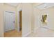 Bright foyer with beautiful tile flooring, neutral wall color, and a view to the outside at 4006 N 27Th St, Tampa, FL 33610