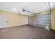 A spacious garage with a roll up door at 4006 N 27Th St, Tampa, FL 33610