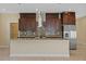 Modern kitchen with granite countertops, mosaic backsplash, and stainless steel appliances at 4006 N 27Th St, Tampa, FL 33610