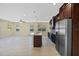 A modern kitchen featuring stainless steel appliances, a center island, and ample counter space at 4006 N 27Th St, Tampa, FL 33610
