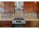 Modern kitchen showcasing stainless steel range and granite countertops at 4006 N 27Th St, Tampa, FL 33610