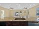 A kitchen island with stainless steel sink, granite countertops and stainless dishwasher at 4006 N 27Th St, Tampa, FL 33610