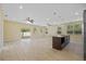 Open-concept living room and kitchen area filled with natural light from sliding glass doors at 4006 N 27Th St, Tampa, FL 33610