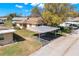 Charming home exterior featuring a carport and well-maintained landscaping at 410 Faraday Trl # A, Sun City Center, FL 33573