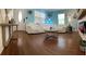 Bright living room with hardwood floors, stylish decor, and comfortable white furnishings at 4710 22Nd N Ave, St Petersburg, FL 33713