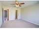 Bright bedroom with a view to a walk-in closet and ensuite bathroom at 5043 Escalante Dr, North Port, FL 34287