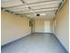 Spacious garage features painted floor and walls, and updated door at 5043 Escalante Dr, North Port, FL 34287