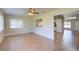 Living room showcasing an open floor plan, tile floors, and natural light at 5043 Escalante Dr, North Port, FL 34287