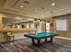 A billiards room with a pool table and decor at 5062 Stone Harbor Cir, Wimauma, FL 33598