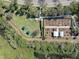 Birds eye view of the community garden with a lush landscape at 5062 Stone Harbor Cir, Wimauma, FL 33598