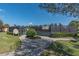 Community pickleball court surrounded by lush landscaping and a black chain link fence at 5062 Stone Harbor Cir, Wimauma, FL 33598