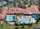 Aerial shot showcasing the large community pool area with separate pools and ample seating at 5062 Stone Harbor Cir, Wimauma, FL 33598