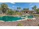 Community water feature with multiple waterfalls, lush landscaping, and palm trees at 5062 Stone Harbor Cir, Wimauma, FL 33598