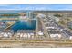 An aerial view of modern townhomes in a waterfront community, highlighting the building's architecture and the water feature at 5351 Bridge St # 81, Tampa, FL 33611