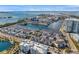 An aerial view showing contemporary townhomes in a waterfront community with a large water basin and stunning ocean views at 5351 Bridge St # 81, Tampa, FL 33611