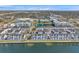The aerial shot shows the community's townhomes with lakeside views, green landscaping, and a central pool area at 5351 Bridge St # 81, Tampa, FL 33611