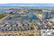 Stunning aerial view of waterfront townhomes and scenic harbor, showcasing the community's prime coastal location and modern design at 5351 Bridge St # 81, Tampa, FL 33611
