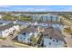 Aerial view of community featuring neat rows of townhomes, manicured landscaping, and community ponds at 5351 Bridge St # 81, Tampa, FL 33611