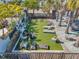 Aerial view of the outdoor grilling and recreation area with Adirondack chairs at 5351 Bridge St # 81, Tampa, FL 33611