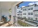 Relaxing balcony with seating offering serene views of the landscaped community at 5351 Bridge St # 81, Tampa, FL 33611
